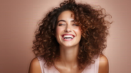 Happy white skinned woman with curly hair enjoys the moment