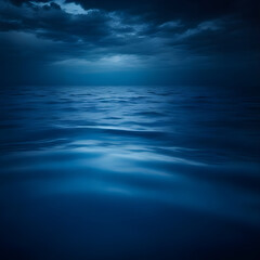 Fototapeta premium Ocean landscape. Silhouette concept. Close-up minimal image of waves in dark blue lake water.