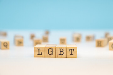 LGBT Letters on Wooden Cubes on a Blue Background