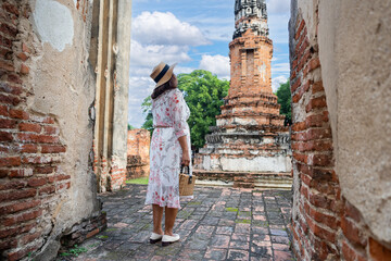 Travel Thailand tourist woman sightseeing Ayutthaya in Asia with old pagoda and spectacular...