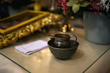 A bowl with holy water for the rite of baptism of a newborn.