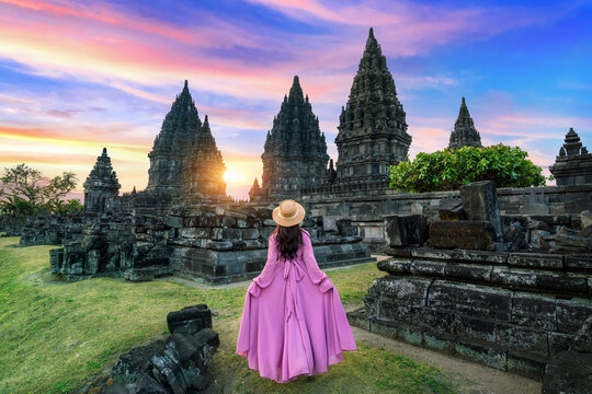 Young woman walking at Prambanan Temple in Yogyakarta, Java, Indonesia.