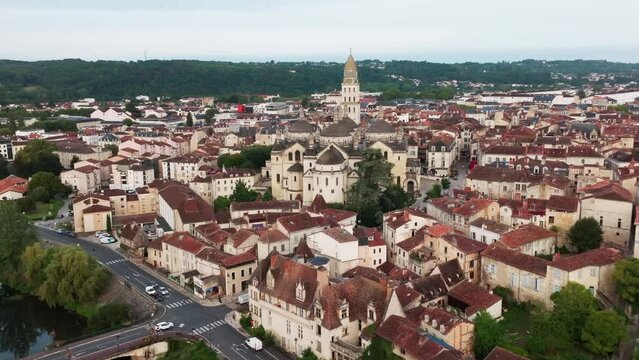 Wide view of the town of Périgeux and the river with the Cathedral Saint Front, drone shot with elevation movement, Dordogne
