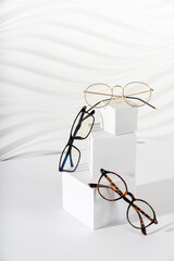 Trendy eyeglasses in plastic and metallic frame on a white background. Close up. Sunglasses and...