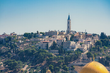 Naklejka premium View of the Mount of Olives in Jerusalem with a bell tower on top of it