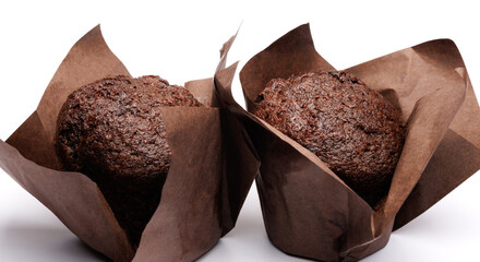 Two chocolate muffins on a white background . Muffin with chocolate chips.