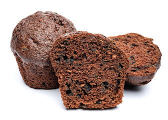 Whole and cut in half chocolate muffin isolated on white background. Chocolate chip muffin.