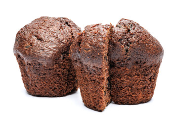 Whole and cut in half chocolate muffin isolated on white background. Chocolate chip muffin.