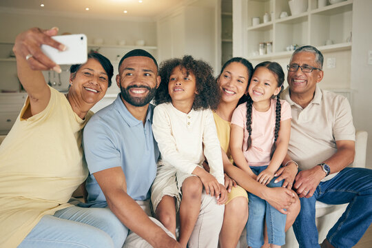 Family selfie, grandparents and children on sofa with social media or online memory for bond, love and happy home. Senior mom, dad and biracial kids in living room for photography or profile picture