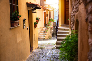 Fototapeta na wymiar Picturesque narrow street of small town in Italy