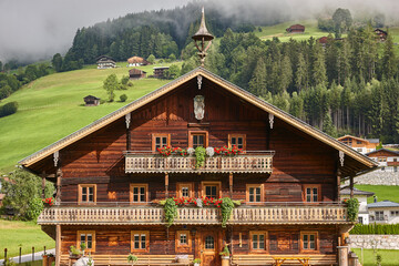 Picturesque mountain rustic wooden house in Austrian alps. Austria - obrazy, fototapety, plakaty