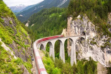 Fotobehang Landwasserviaduct Swiss red train on viaduct in mountain, scenic ride