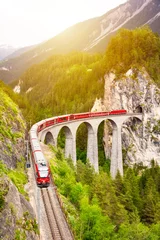 Fotobehang Landwasserviaduct Swiss red train on viaduct in mountain, scenic ride