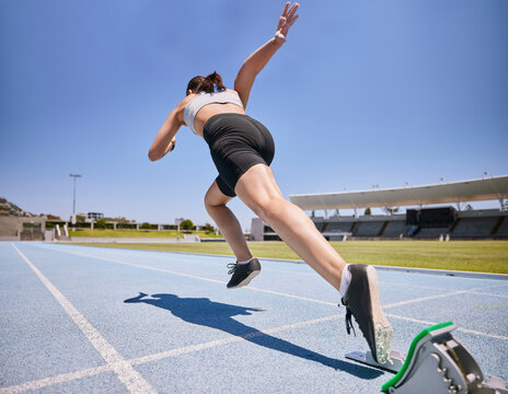 Woman track runner, start running and sprint training for race exercise, fitness workout and using starting blocks for speed. Competitive sports athlete, fast sprinter and girl exercising for cardio