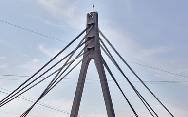 Close up image of North Bridge in Kyiv, Ukraine. Bridge over the Dnieper river aginst a blue sky background