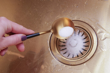 Cleaning kitchen sink with bakIng soda to keep sinks draining well and prevent clogs. Safe,...