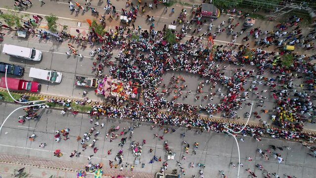 Birds eye view of huge crowd moving on busy roads during immersion of lord ganesha