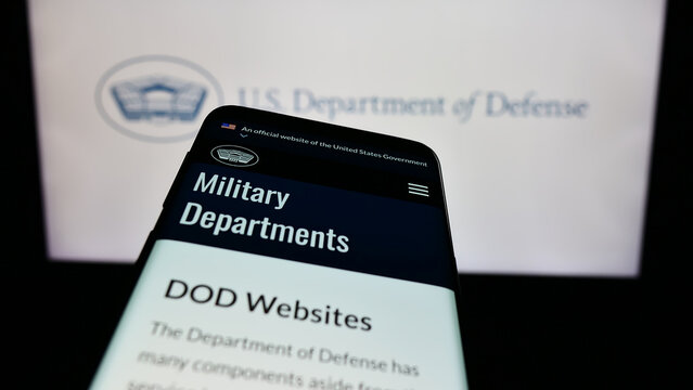 Stuttgart, Germany - 10-29-2023: Mobile phone with website of United States Department of Defense (DoD) in front of logo. Focus on top-left of phone display.