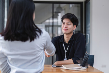 Handshake of cooperation customer and salesman after agreement, successful car loan contract buying or selling new vehicle