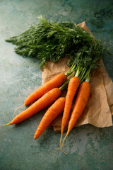 Fresh organic carrot with green tops