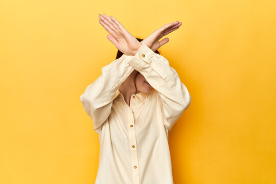 keeping two arms crossed, denial concept.