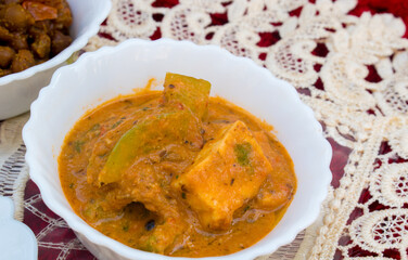 North Indian Thali containing Paneer Kadhai Sabzi or Cottage Cheese Curry without Onion Garlic . Selective focus on subject 
