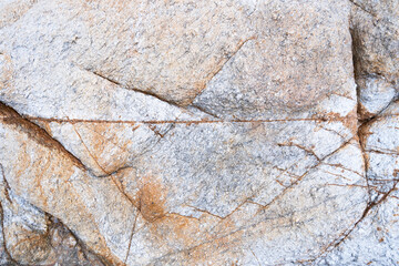 Geological structure. Rock fracture. Fracture in weathered metamorphic rock. Weathered stone background.
