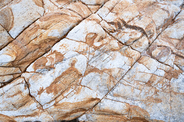 Geological structure. Rock fracture. Fracture in weathered metamorphic rock. Weathered stone background.