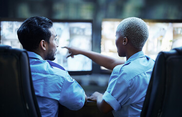Security guard in control room, man and woman with screen to check cctv together in team office....