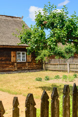Small cozy houses. Wooden ancient buildings. Summer village and vacation. Farm bio products.