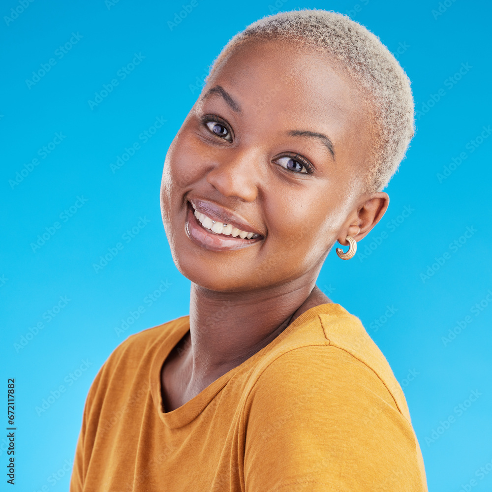 Sticker Black woman, portrait and happy, smile in a studio with youth and positive mindset isolated on blue background. Casual fashion, headshot and African female person, face and t shirt with happiness