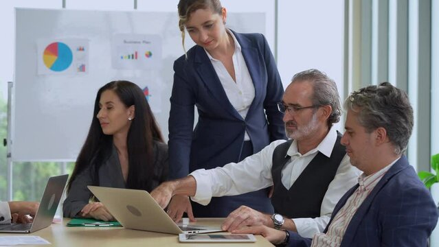 problem of laptop computer is broken while group of diverse business people working together can't use laptop computer to discussing on table in meeting room