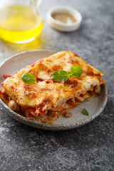 Traditional homemade lasagna with fresh basil