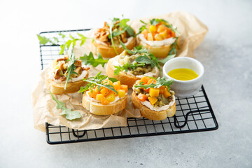 Healthy crostini with pumpkin and mushroom