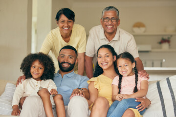 Parents, kids and portrait of big family in home for love, care and quality time together. Mother, father and grandparents relax with young children in living room for support, smile and generations