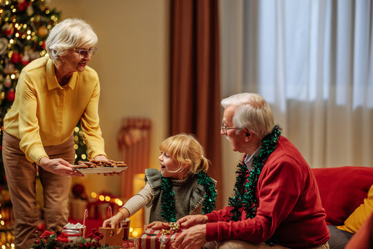 Grandma bringing Christmas cookies during family hangout