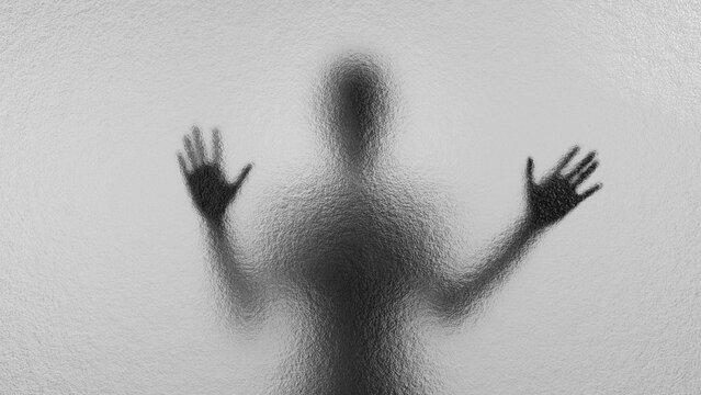 Blurred silhouette behind matte glass. Creepy Halloween concept.