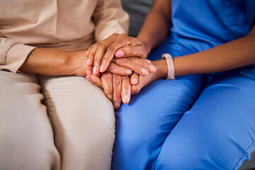 Hands, medical or support with a nurse and patient in a living room for love, trust or care during...