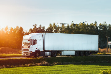 Cargo truck on the mountain highway. Delivery truck on the Europe motorway. Global delivery concept.