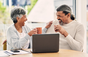 Old couple, laptop and laughing with retirement and coffee, manage finance paperwork and funny together at home. People do taxes online, pension policy documents and budget, woman and man with comedy