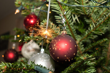 Obraz na płótnie Canvas Bengal fire is sparkling on a christmas tree in Liechtenstein