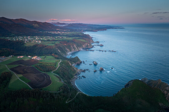 Golden Horizon: Aerial Sunset View of Asturias Coastline