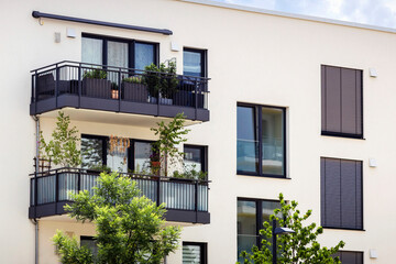 Modern Building Facade Exterior in Munich Germany with Modern Balcony, Window Blinds, Landscape....