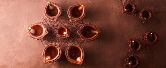 Burning diya on Happy Diwali, background for light festival of India