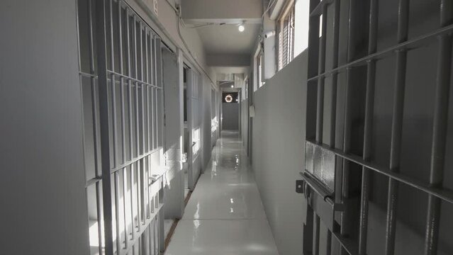 Hallway full of empty Prison jail cells