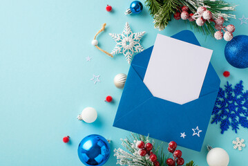 Top view image of a Santa's wish list letter with festive decorations, pine branches in hoarfrost, and holly berries on a pastel blue background with blank space for text - obrazy, fototapety, plakaty