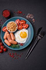 Fried chicken eggs, sausages, cherry tomatoes, chickpeas, spices, salt and herbs