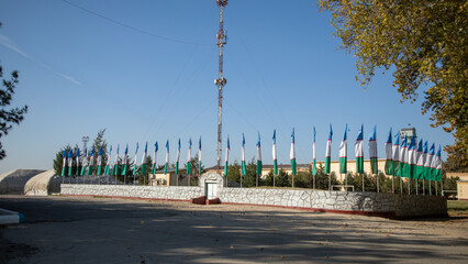 Uzbekistan flag near cotton industry - obrazy, fototapety, plakaty
