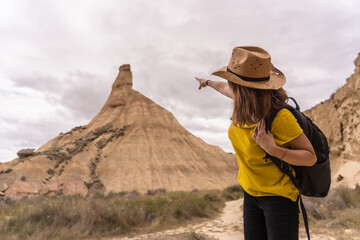 Woman pointing to a rock formation in a national aprk