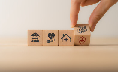 Health insurance concept. Healthcare, finance and medical service. Benefits of health insurance, medical expenses, providing financial security. Wood block with health insurance and money saving icon. - obrazy, fototapety, plakaty